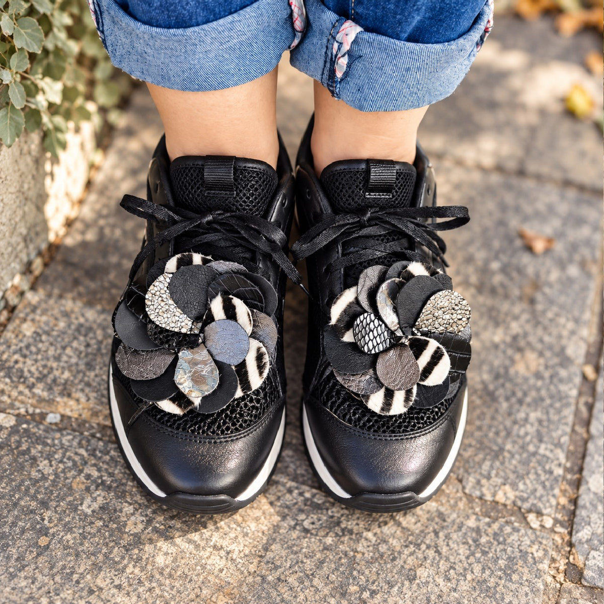 Black, silver and zebra leather flower sneaker charms on black sneakers – MARTINELI